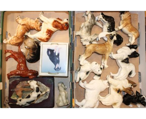 A large collection of ceramic dogs to include examples by The Leonardo Collection, Coopercraft, and similar manufacturers. (Q