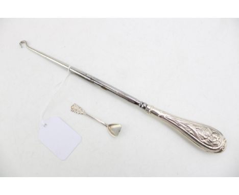 A large silver handled button hook, Birmingham 1906, H Matthews, with a sterling silver condiment spoon (2).
