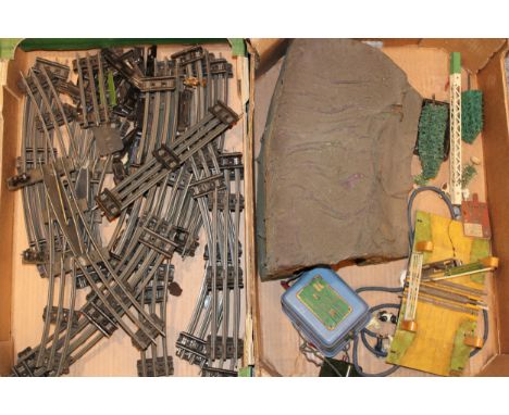 A collection of vintage O gauge model railway track (including points), controller, accessories and lead Britains type figure