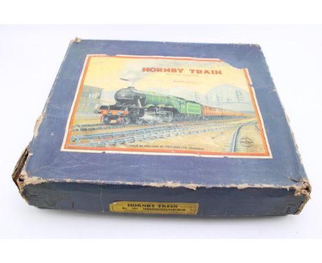 An 0 Guage clockwork Hornby model Railways boxed set to include black livery 0-2-0 tender engine and good vehicles.