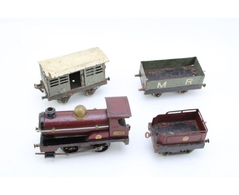 A Hornby clockwork train set circa 1920s, to include engine and tender, cattle truck and M R wagon. (4)
