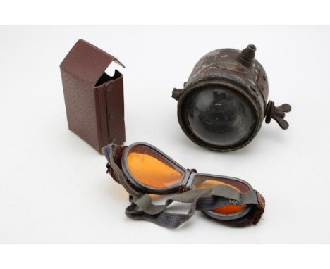 A C.A.V motorcycle headlamp with bullseye lens together with a pair of goggles in leatherette box. (2)
