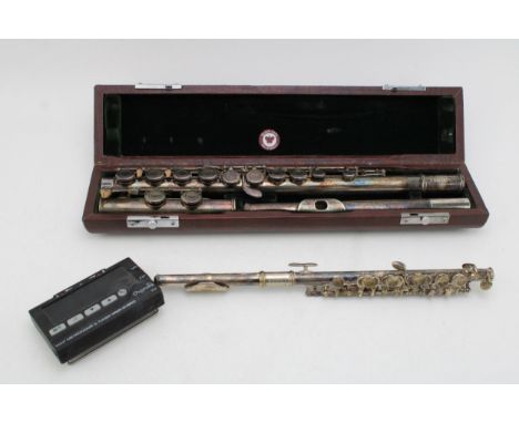 A Rudall - Carte Sonata NSE flute together with a Chase piccolo and a Cherub Metronome and Tuner. (3)