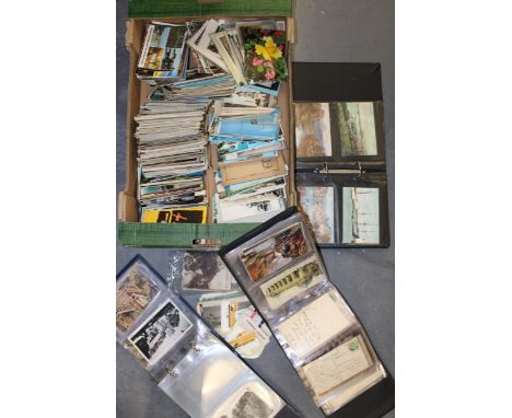 A large mixed collection of antique and vintage postcards to include three folders together with loose postcards, booklet on 