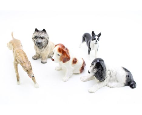 A collection of ceramic dog figures to include Elite Pottery 'Greyhound', Sylvac 'Spaniels' and 'Cairn Terrier' and other sim