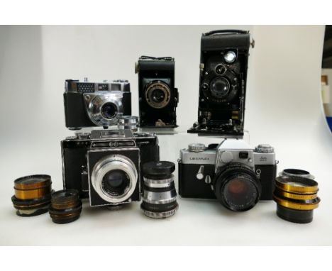 A collection of camera equipment to include Leitz Wetzlar Leicaflex with Wetzlar Summicron 1:2/50 lens, serial number 1154415