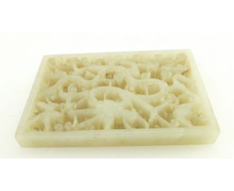 Qing Dynasty (1644-1911) A Chinese white Jade pierced carved dragon plaque, 8cm x 6cm