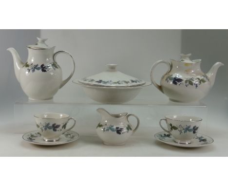 A large collection of Royal Doulton burgundy patterned tea and dinner ware to include cups, saucers, tureens, side plates, te