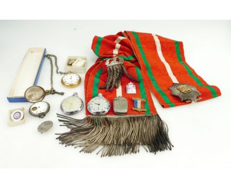 A collection of various items to include silver & other pocket watches, badges, military sash with badges etc