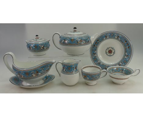 A collection of Wedgwood tea and dinner ware in the Florentine pattern to include cups, saucers, teapot, gravy boat, soup bow