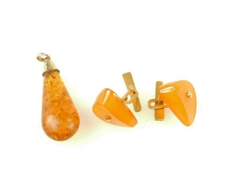 A vintage pair Baltic butterscotch amber cufflinks with 18ct gold mounts and a pendant with unmarked gold mount (total weight