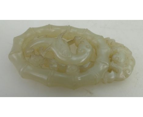 Qing Dynasty (1644-1911) A Chinese pierced white Jade dragon pendant, height 6.8cm