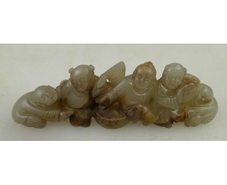 Qing Dynasty (1644-1911) A Chinese white & russet Jade carving group brush rest of five boys, length 10.3cm