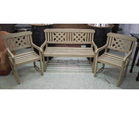 GARDEN BENCH, grey painted with trellis back 126cm W and a pair of matching armchairs 64cm W. (3)