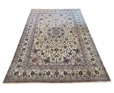 FINE PART SILK ISPHAHAN CARPET, 305cm x 205cm, palmette and vine design, ivory field within corresponding borders.