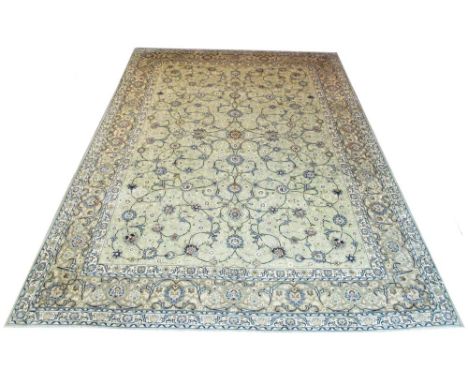 FINE KASHAN CARPET, 430cm x 295cm, jade field of scrolling vines and palmettes.