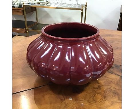 A large Dunmore Scottish pottery jardiniere, of lobed circular form and sang de boeuf glaze, with mark to base (20cm x 33cm)