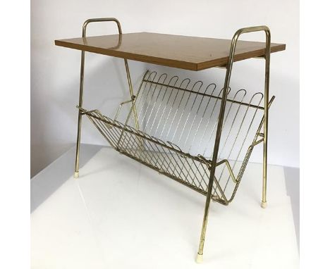 A vintage Atomic style magazine table, the rectangular top flanked by two handles, above a wirework magazine tray, on straigh
