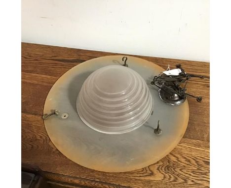 A 1930s/40s pendant light, the opaque glass disc suspended by three chains, with central beehive dome (12cm x 40cm excluding 