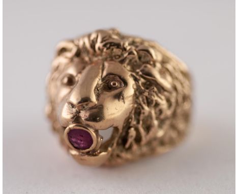 9ct GOLD RUBY LION HEAD RING. Cast as a lion head with a round ruby in the mouth, ring size P1/2, 17.26g good condition.