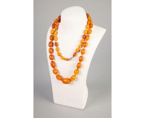 GRADUATED AMBER BEAD NECKLACE, of oval beads knotted to a jump ring clasp, length 93cm, 54.47g