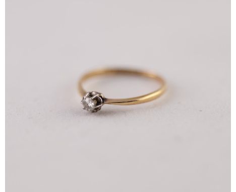 SOLITAIRE DIAMOND RING. A round brilliant cut diamond in a claw setting, estimated diamond weight 0.10ct approximately, stamp