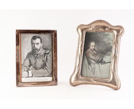 OAK FRAMED SILVER FRONTED EASEL PHOTO FRAME of Art Nouveau flavour, 7 1/2 " (19) high Birmingham 1984 and an oblong plain sil