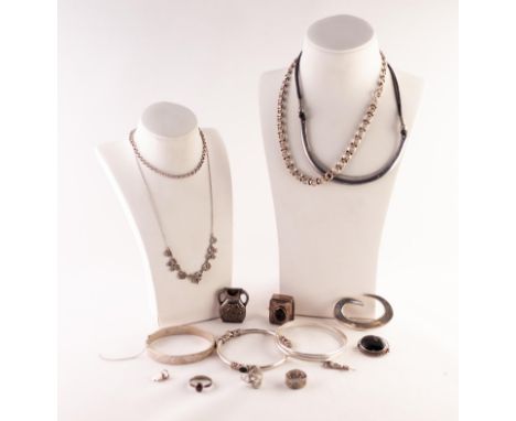 SILVER JEWELLERY, including an onyx inlaid Celtic motif bangle, two other bangles, a silver and marcasite bow necklace, three