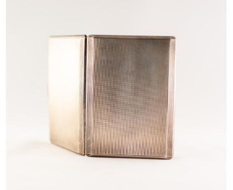 A SILVER OBLONG POCKET CIGARETTE CASE, with engine turned decoration, canted borders, 4 ½? (11.4cm) wide, Birmingham 1960, 5.