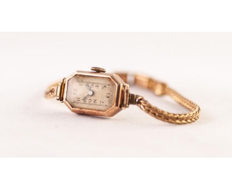 LADY'S 9ct GOLD WRISTWATCH with jewelled movement, narrow rectangular silvered arabic dial with canted corners, rolled gold n