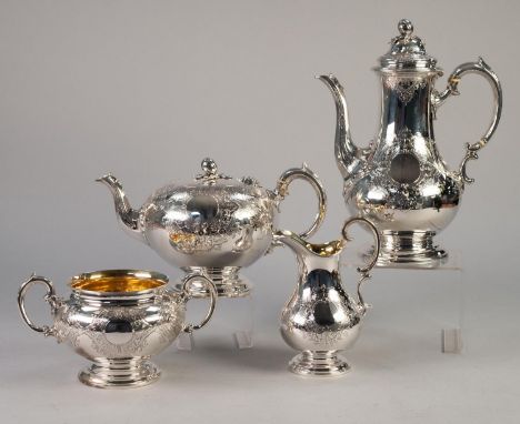 AN ATTRACTIVE VICTORIAN SILVER FOUR PIECE TEA AND COFFEE SERVICE, the bodies each finely engraved with strapwork conjoined fo