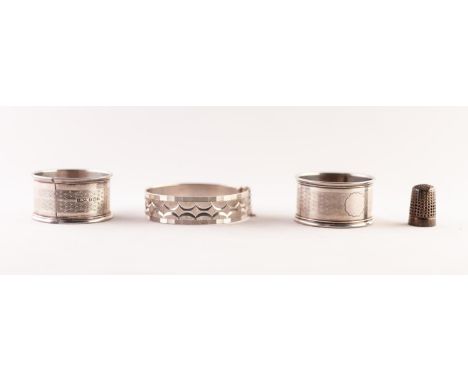 PAIR ENGINE TURNED SILVER NAPKIN RINGS, Birmingham 1925; A SILVER THIMBLE AND A SILVER BRIGHT-CUT ENGRAVED BANGLE (4)