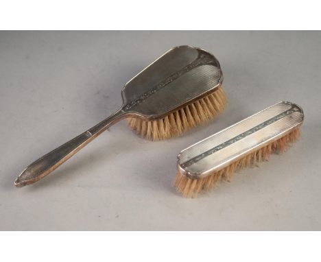 A POST WAR ENGINE TURNED SILVER BACKED HAIR BRUSHES AND MATCHING CLOTHES BRUSH