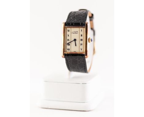 MUST DE CARTIER GENTS SILVER GILT TANK WATCH with Swiss quality movement, silvered oblong dial with Roman numerals in two col