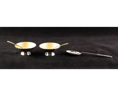 PAIR MID 20th century SILVER AND ENAMELLED CIRCULAR OPEN SALTS AND SPOONS yellow interior to the conical bowls on deep foot r