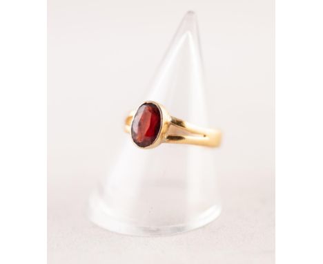 VICTORIAN 22ct GOLD DRESS RING, collet set with an oval red stone, Birmingham 1881, 2.2gms, ring size M/N