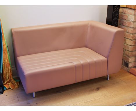A modernist two-part modular leather sofa - comprising a larger part in chestnut brown leather, the smaller end section in pa