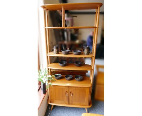 An Ercol elm and beech room divider, cat no.363 circa 1960's fixed upper shelf over two adjustable shelves, 192cm high