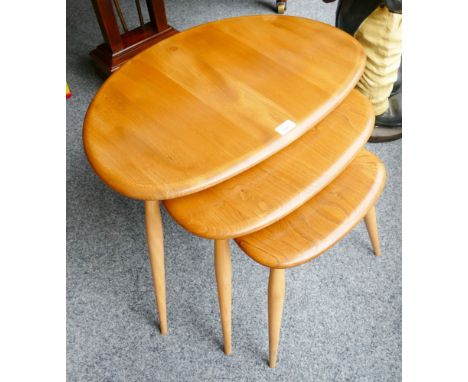 An Ercol elm and beech nest of three tables, cat no.354 circa 1960's, 41cm high