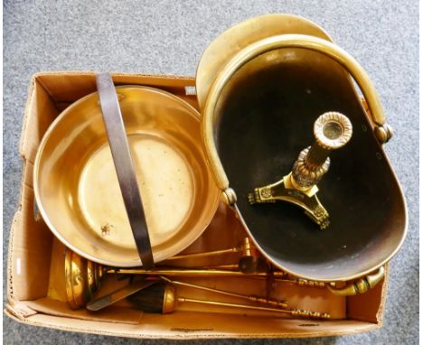 A copper coal helmet, brass candelabra, jam pan and companion set