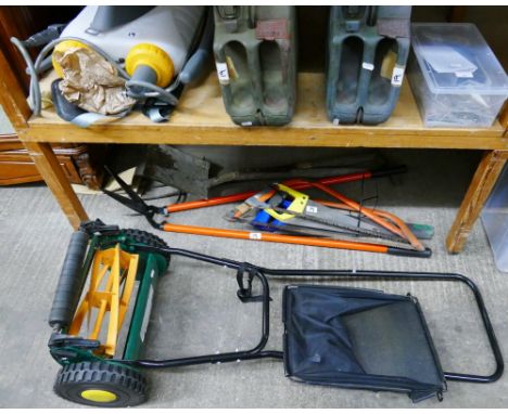 A manual lawn mower, a back pack sprayer, garden tools, saws and two jerry cans