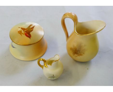 A Royal Worcester miniature cabinet jug, painted with a study of a Kingfisher signed Powell, a Royal Worcester box and cover 