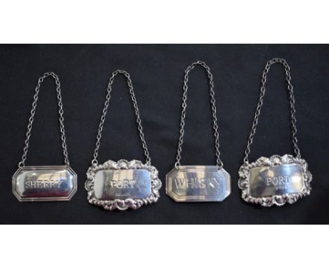 A silver Georgian style decanter ticket, whisky, Birmingham hallmarks; another similar, sherry; a pair silver port decanter t