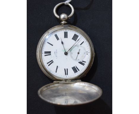 A silver Hunter pocket watch