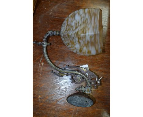 A 19th century brass swan neck wall lamp bracket, with mottled glass shade
