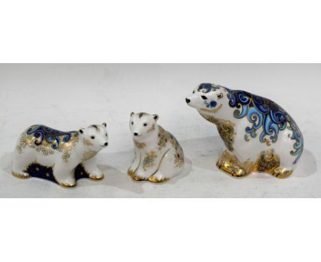 A Royal Crown Derby paperweight, Polar Bear, gold stopper, boxed; two other, Polar Bear Cub Standing, gold stopper, boxed; Po