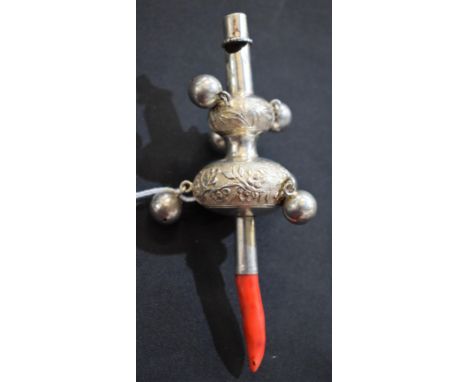 A Chinese silver child's rattle, chased with bamboo and blossoming prunus, coral teether to haft, 14cm long, indistinctly mar