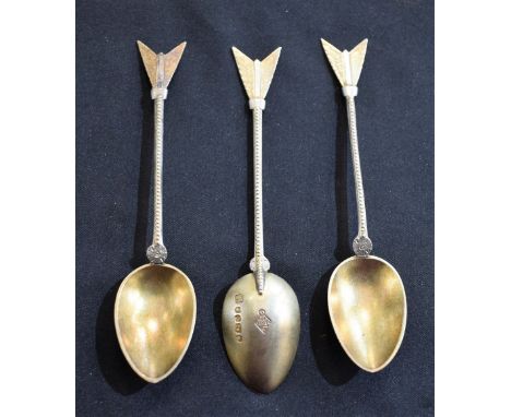 A set of three Victorian silver-gilt novelty spoons, arrow terminals, registration lozenge marks, Martin, Hall &amp; Co, Shef