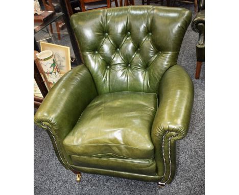 A contemporary scroll arm button back reading chair