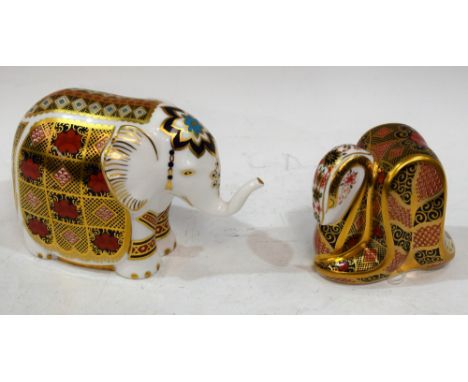 A Royal Crown Derby paperweight, Elephant, printed with the 1128 pattern, gold stopper, boxed; another, Imari Snake, gold sto